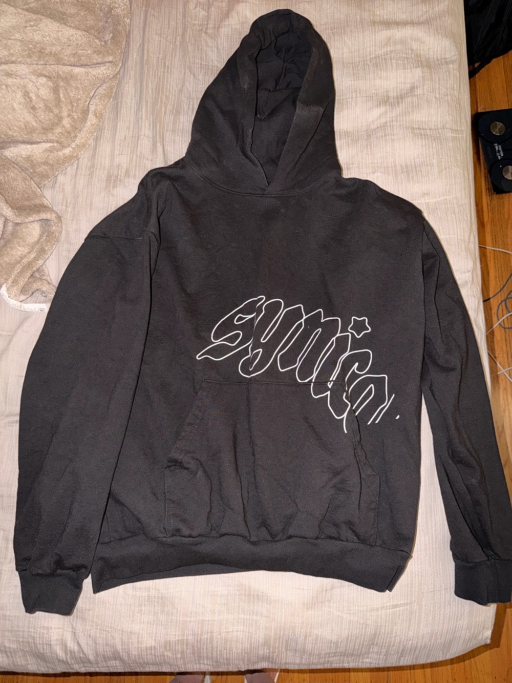 Synical Black Pullover Hoodie with White Outline Script